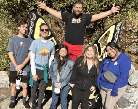 a group of people posing for a photo