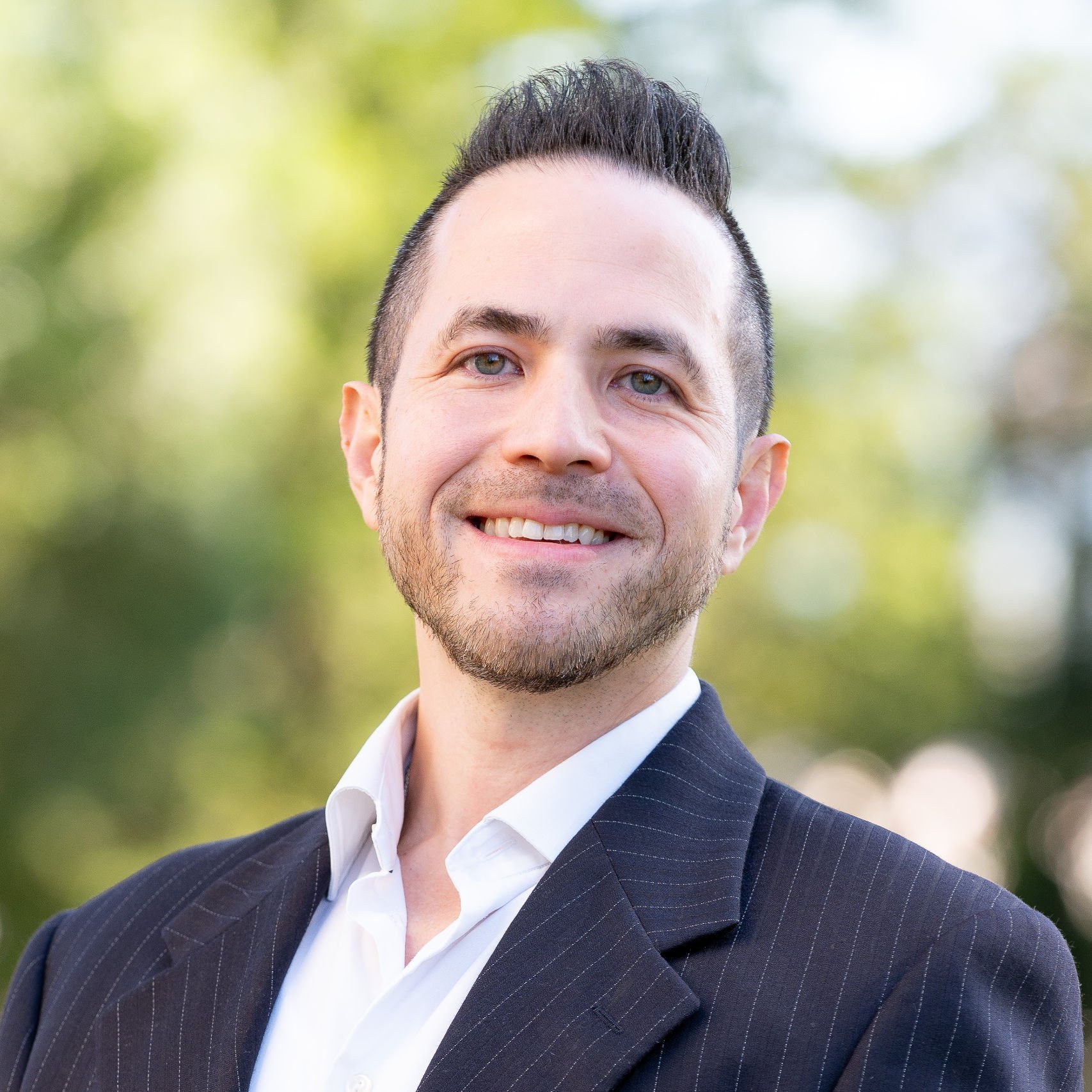 a person in a suit smiling