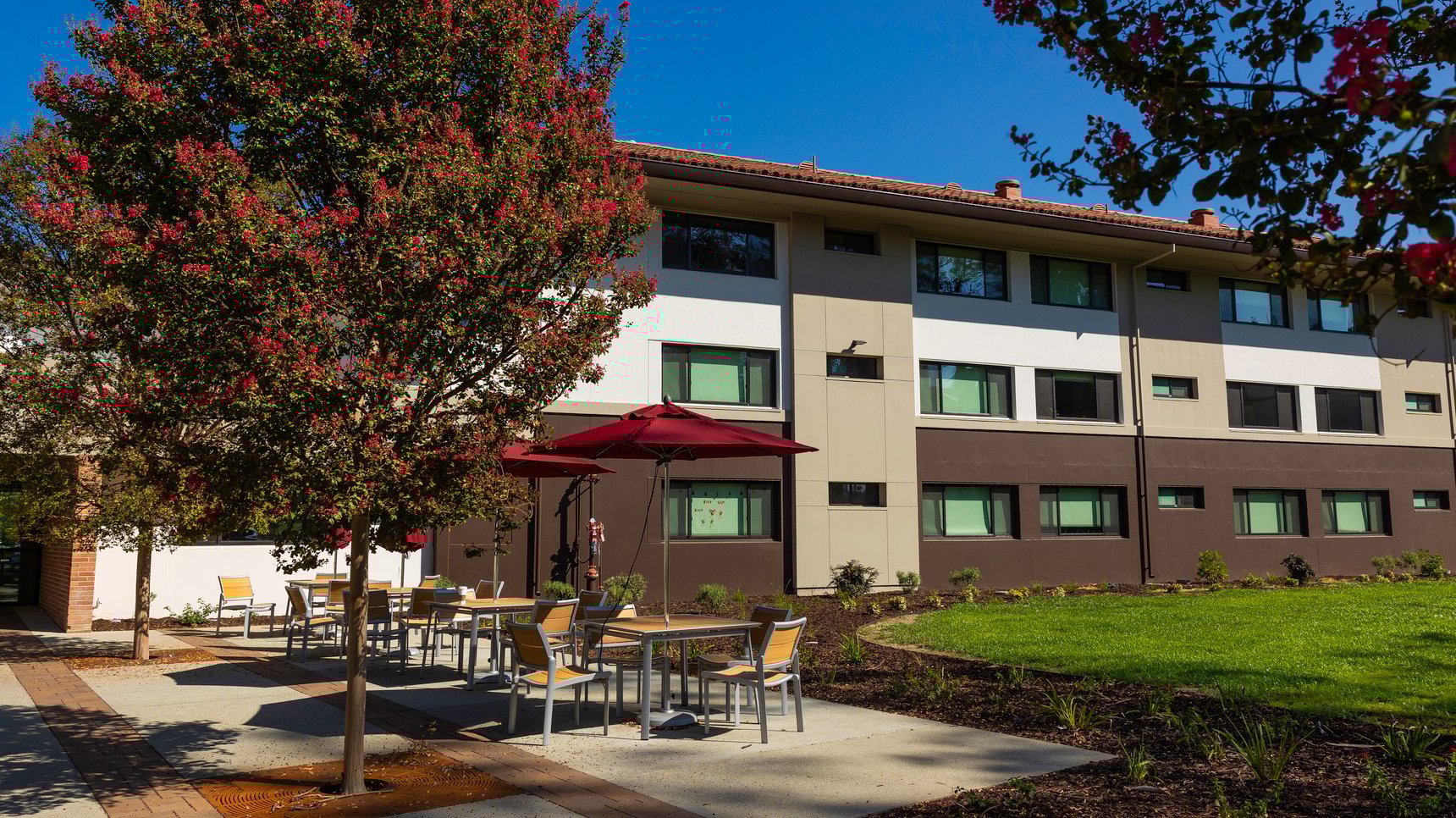 a building with tables and chairs outside