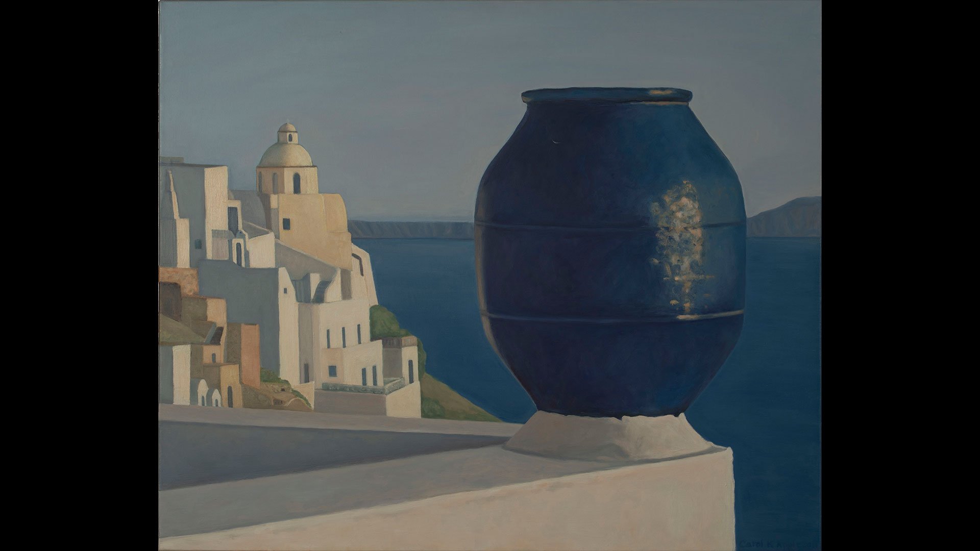 a large blue pot on a ledge overlooking a white city