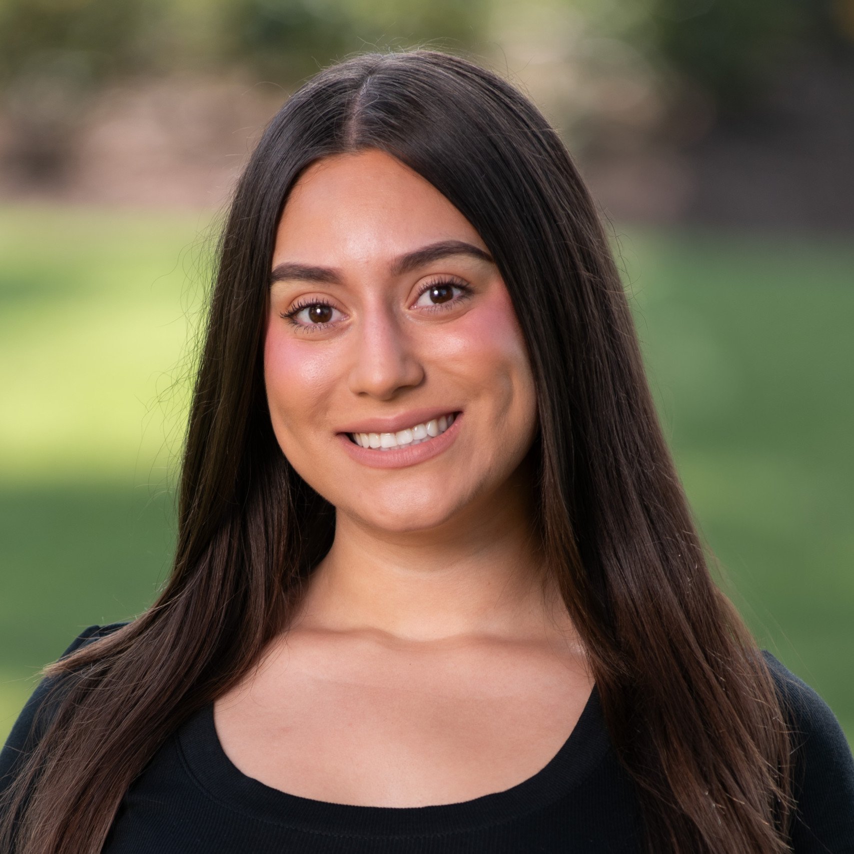 a woman smiling at camera