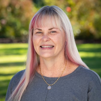 a woman with blonde hair smiling