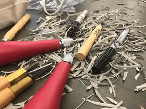 a group of pens and nibs on a table