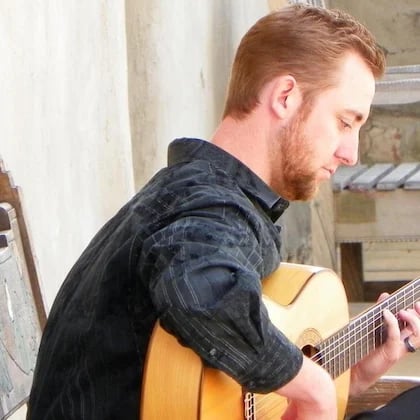 a man playing a guitar