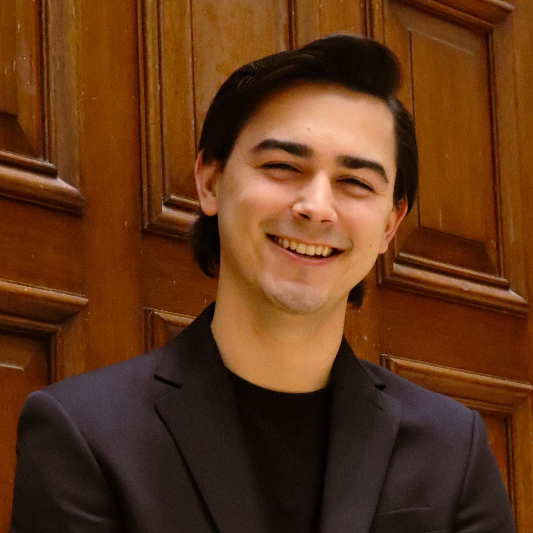 a man smiling at camera