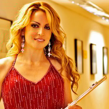 a woman holding a flute