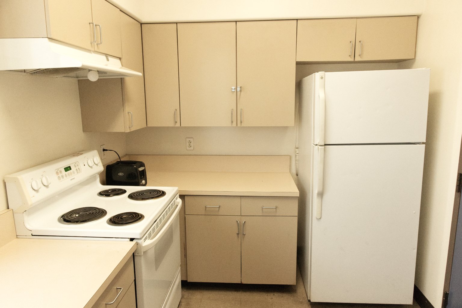a kitchen with white appliances