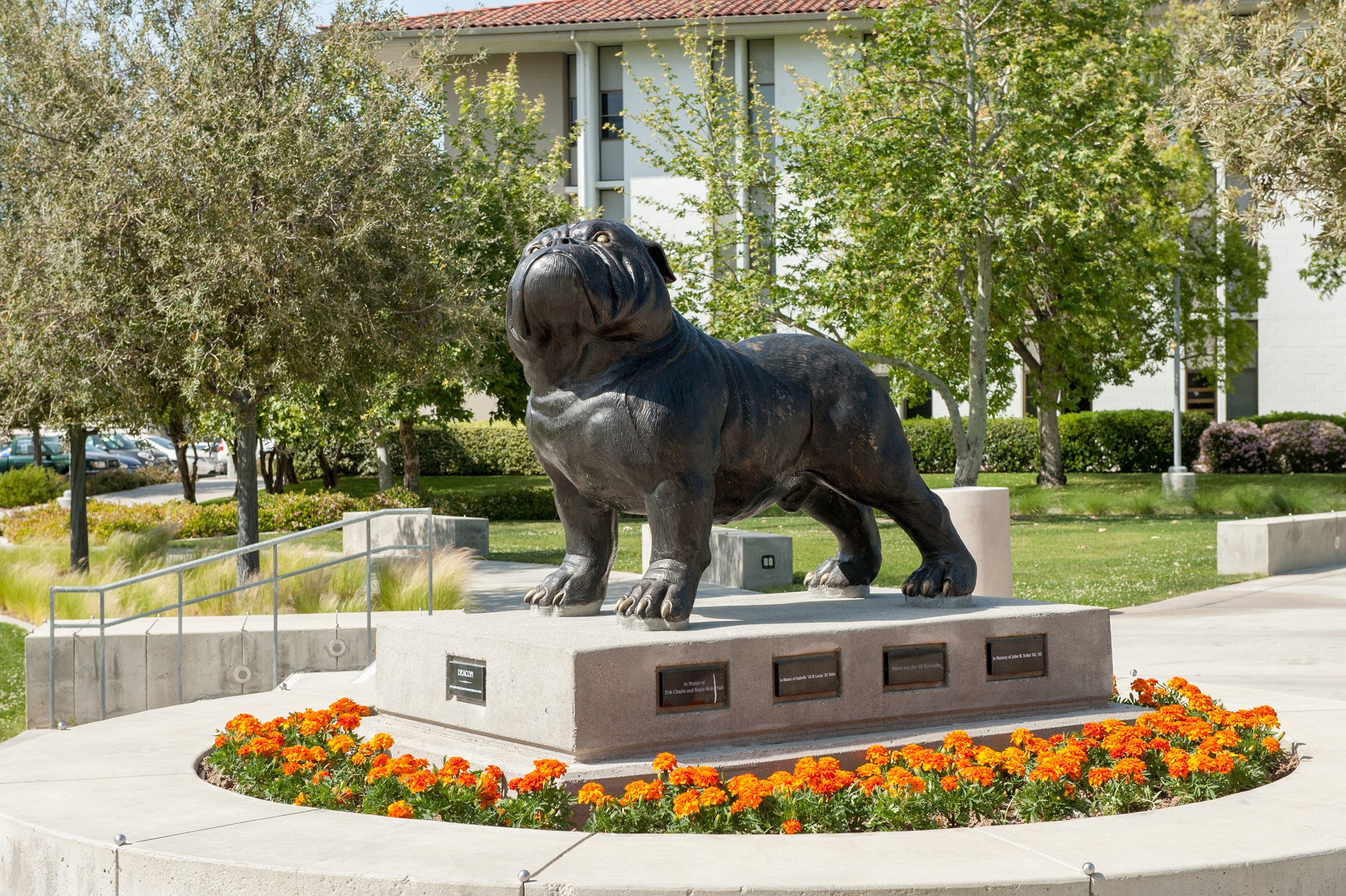 a statue of a dog in a park