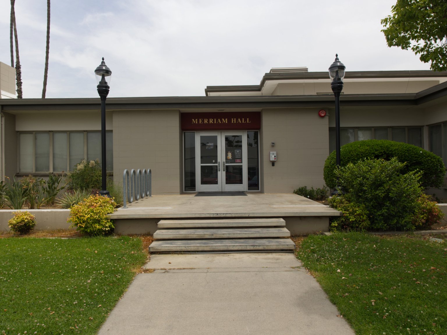 a building with a door and stairs leading to it