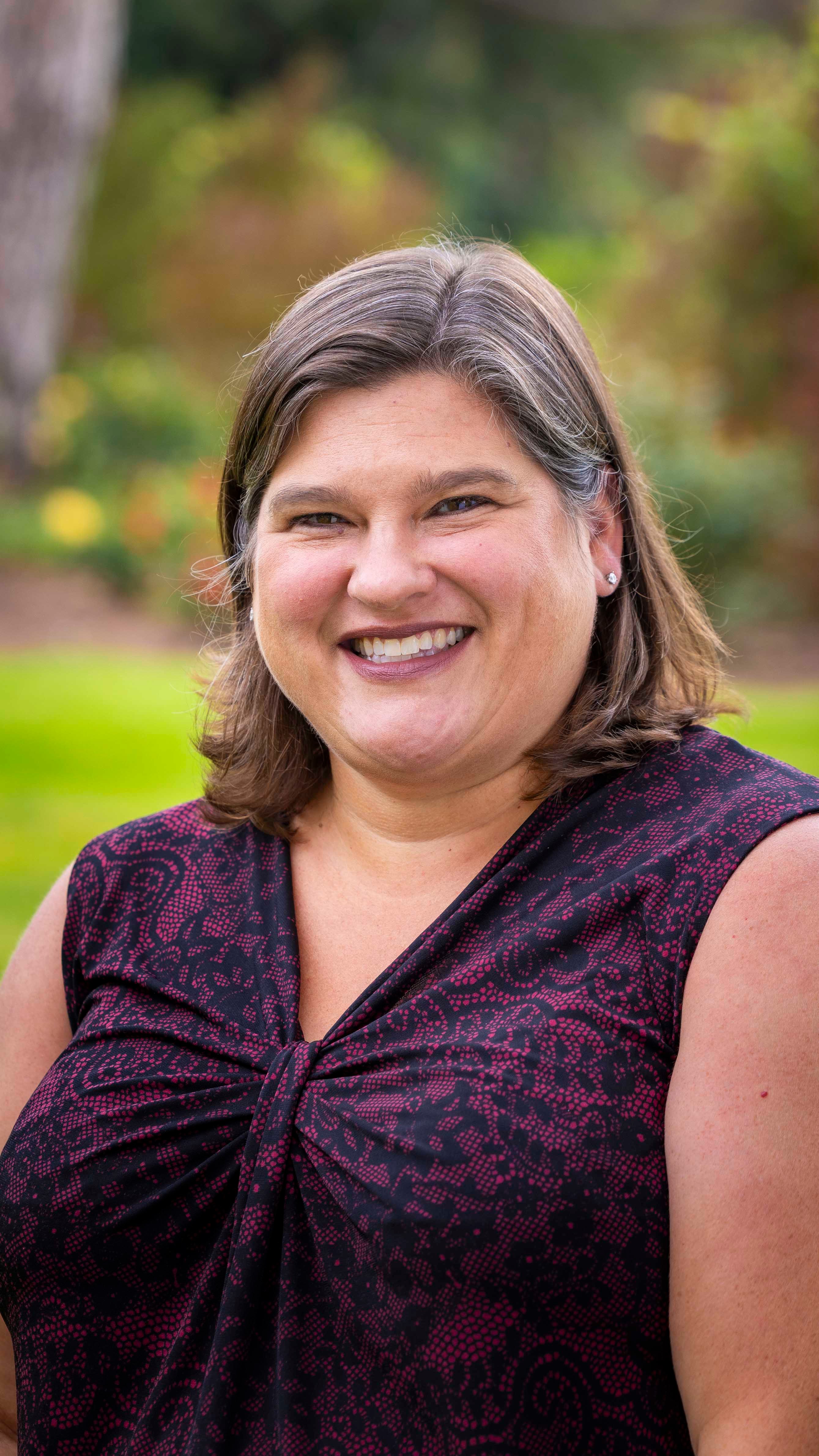 a woman smiling at camera