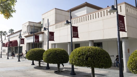 a building with a few bushes