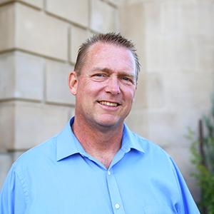 a man in a blue shirt