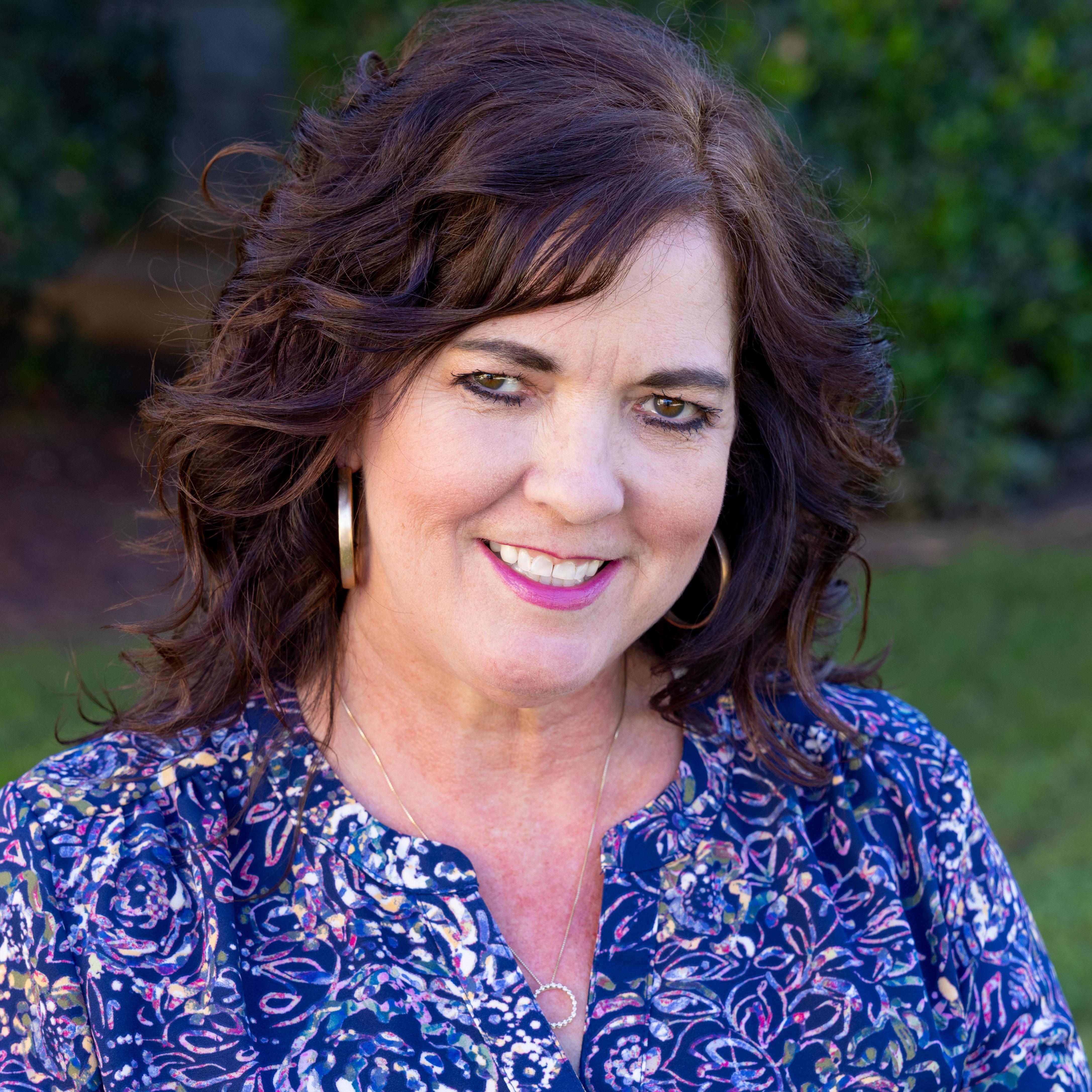 a person smiling at the camera