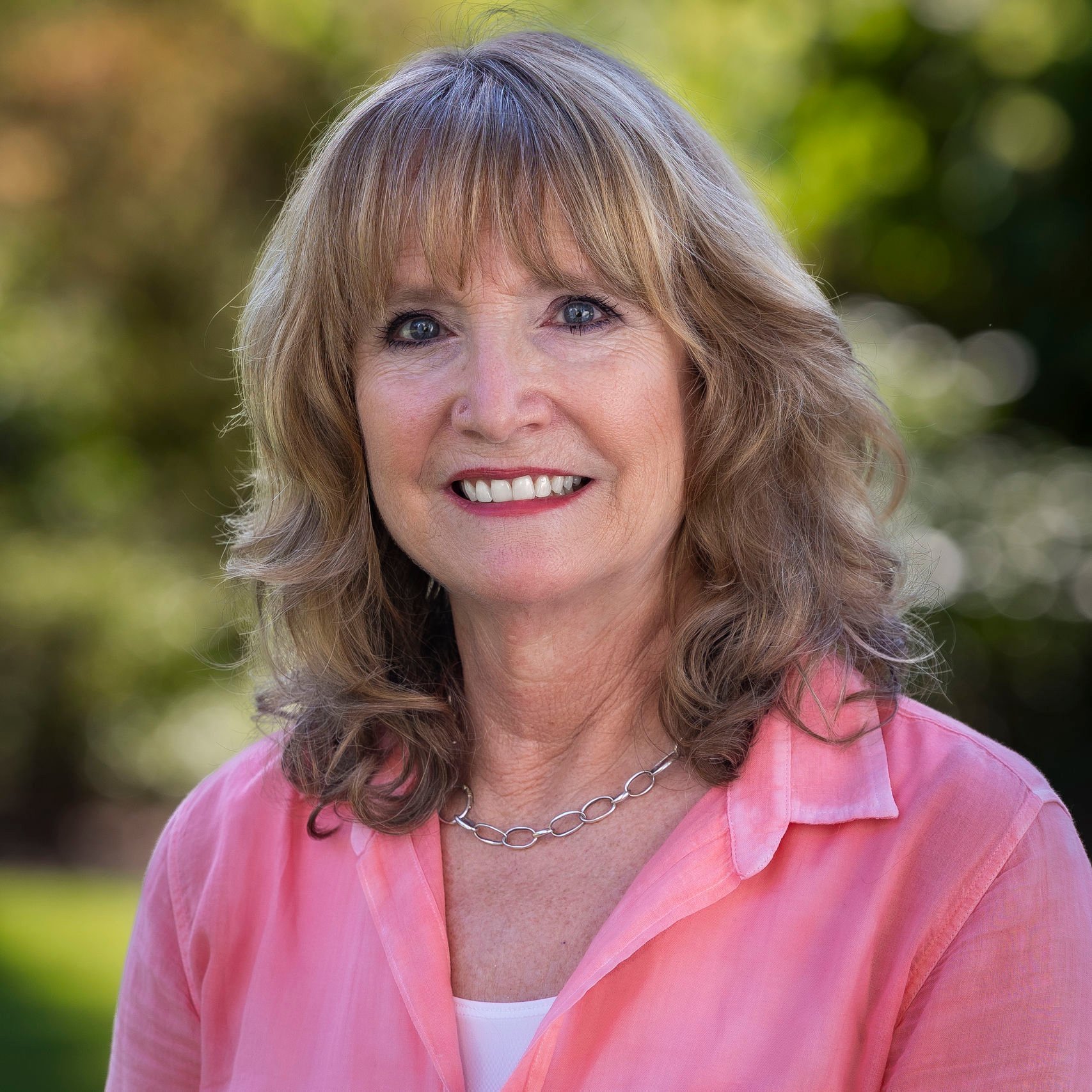 a woman smiling for the camera