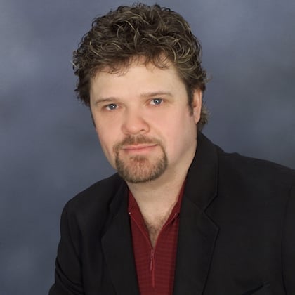 a man with a goatee and a beard