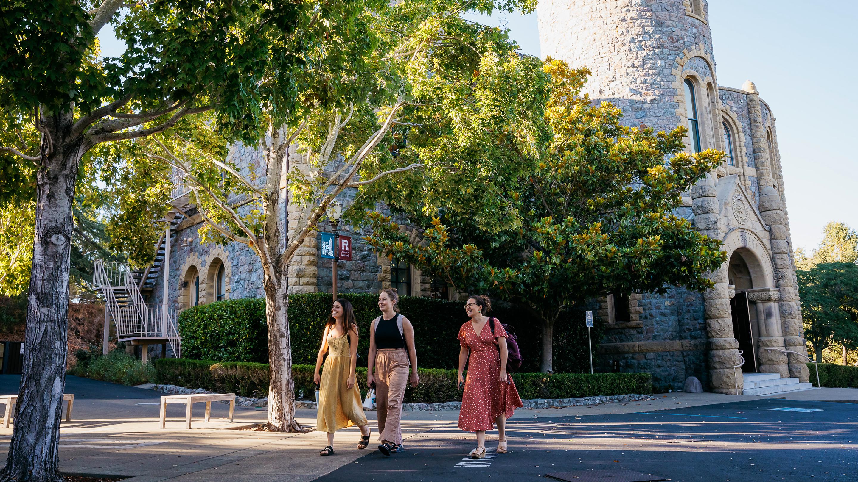 a group of women walking on a street