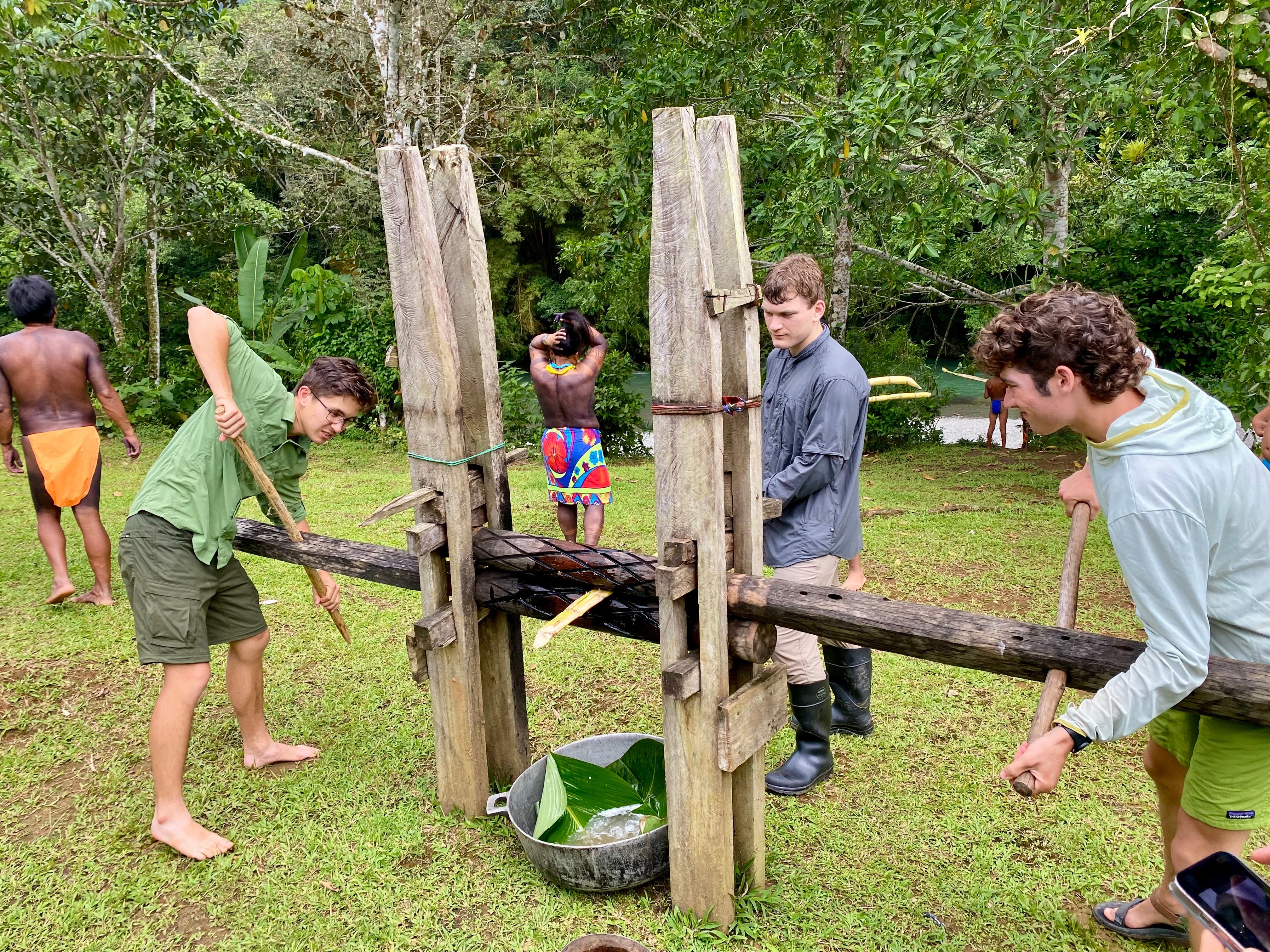 a group of childs working on a wooden structure