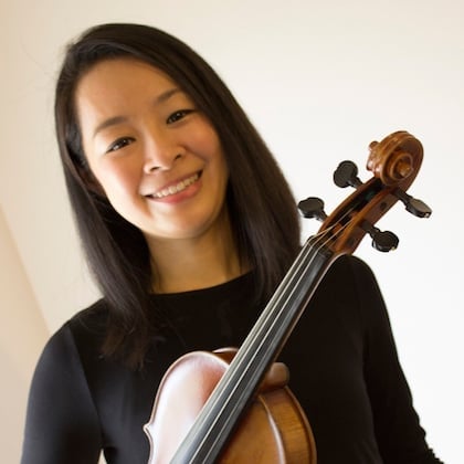 a woman holding a violin