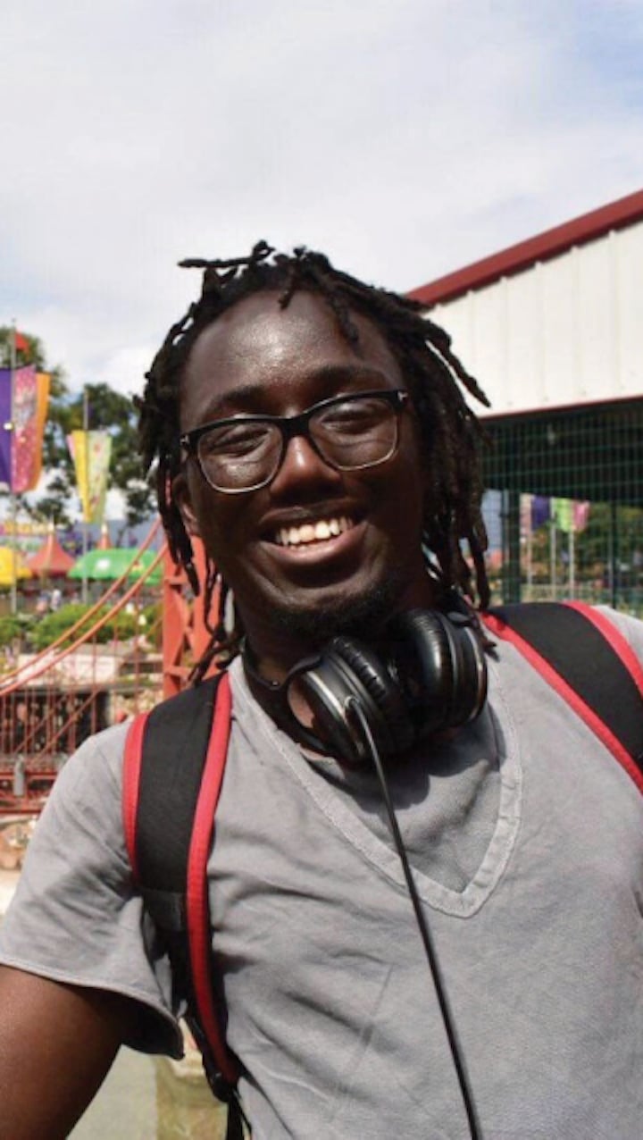 a man with headphones around his neck