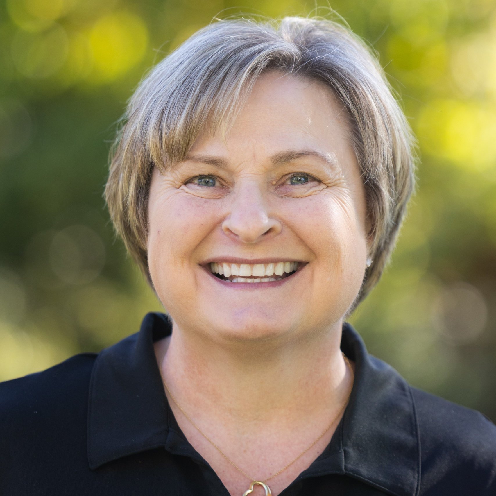 a woman smiling for a picture
