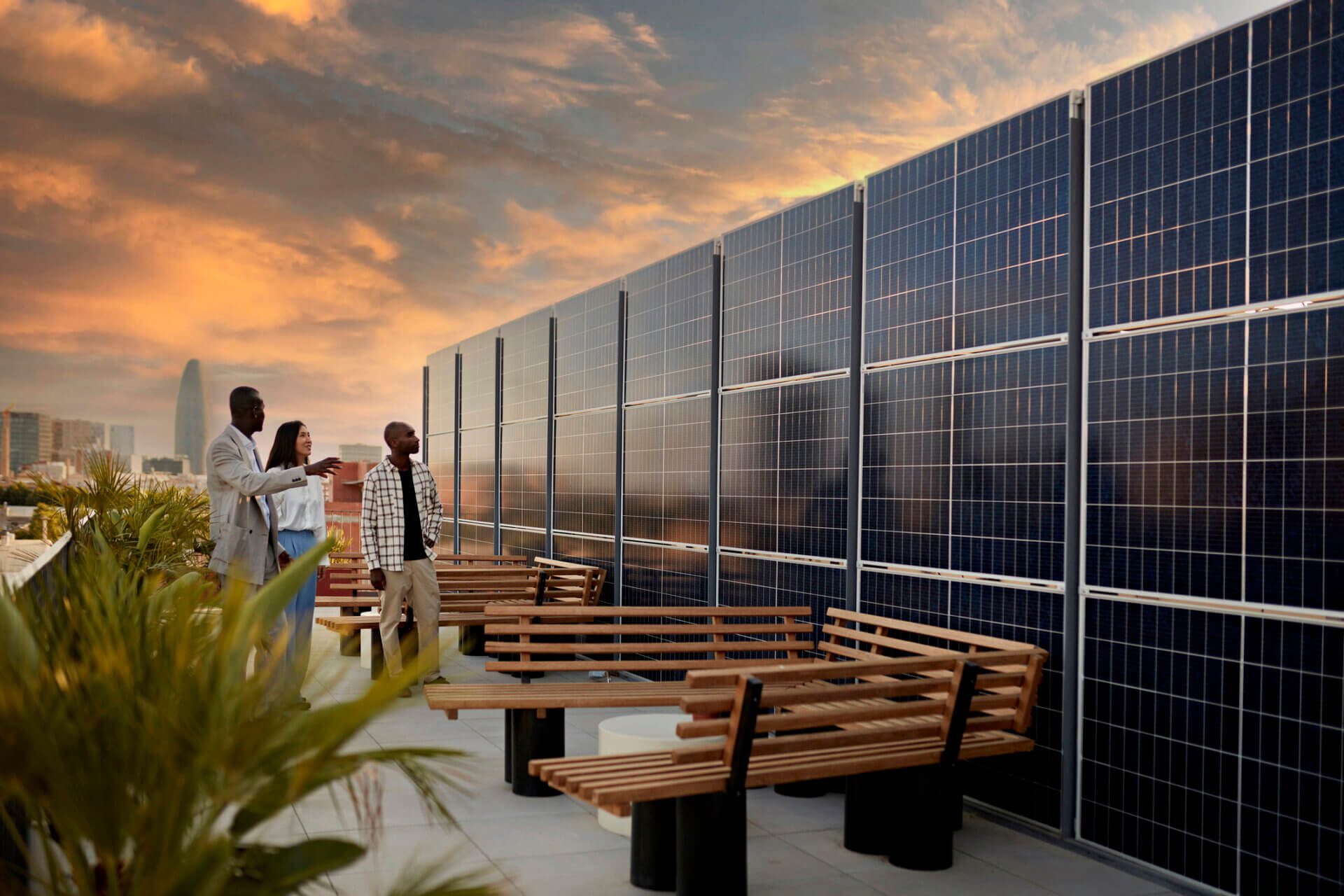 a group of people standing next to a solar panel