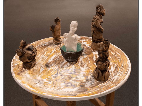 a table with a group of sculptures on it