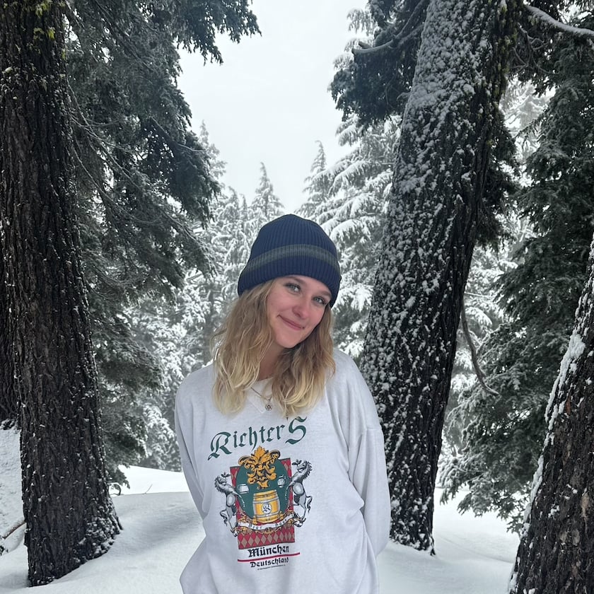 a woman standing in snow