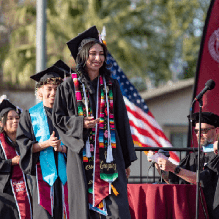 a group of people wearing graduation gowns and caps