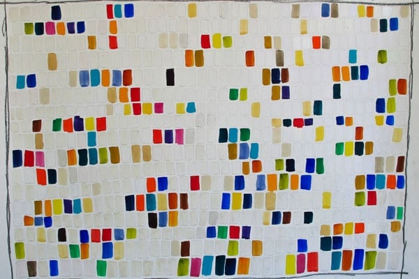 a white wall with many squares of different colors