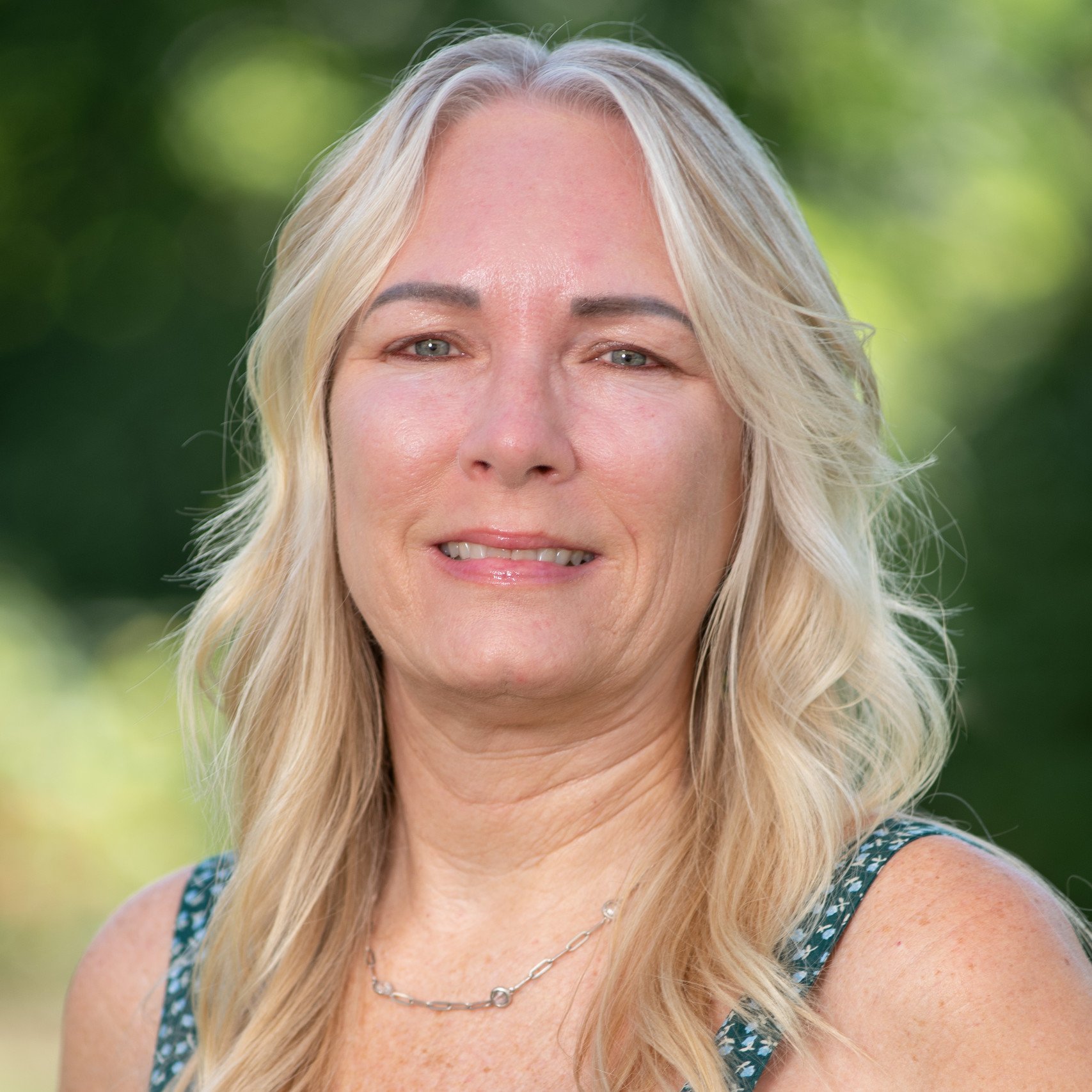a woman with blonde hair smiling