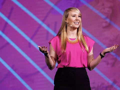 a person in pink shirt and black pants