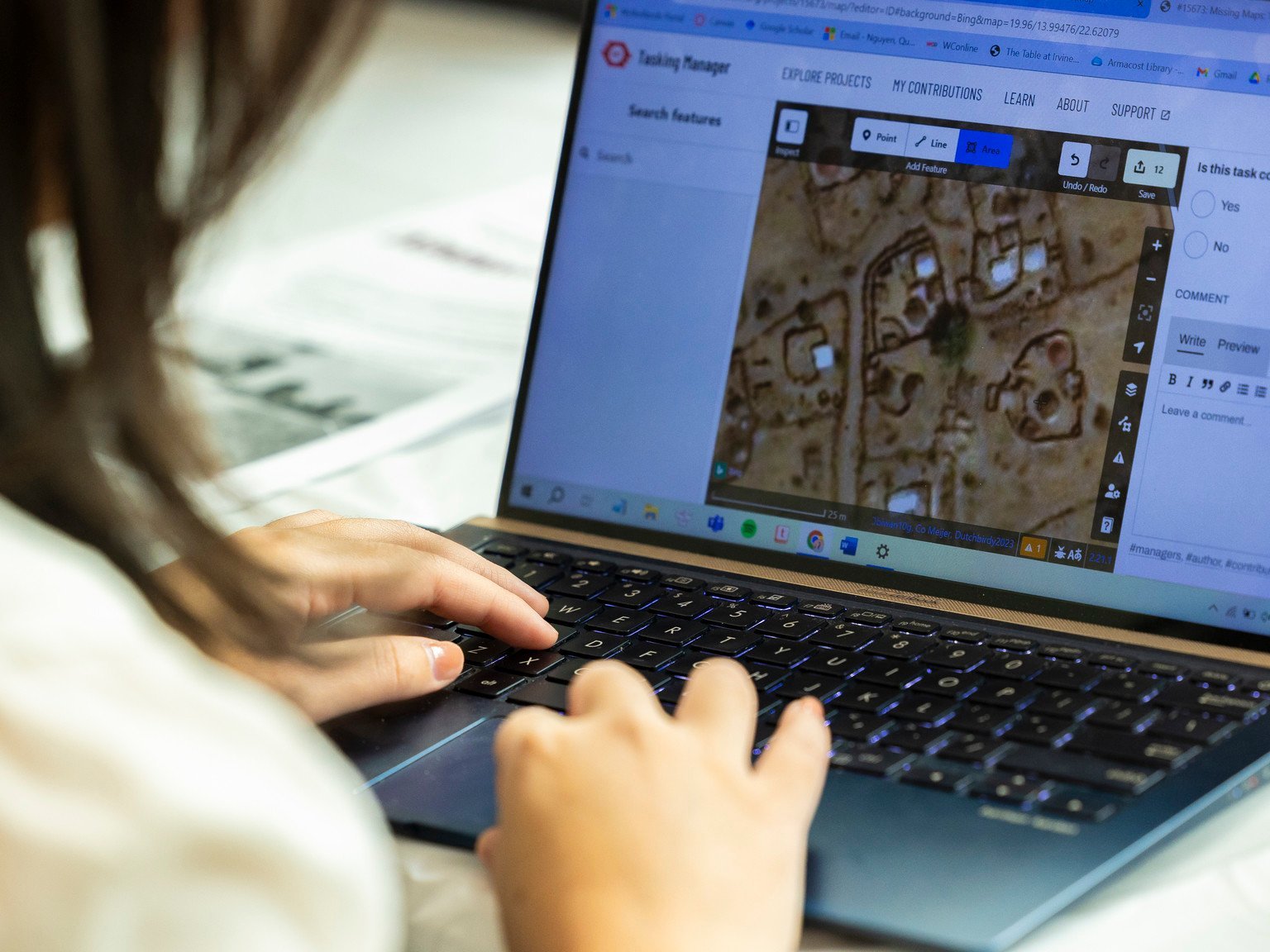 a person typing on a laptop