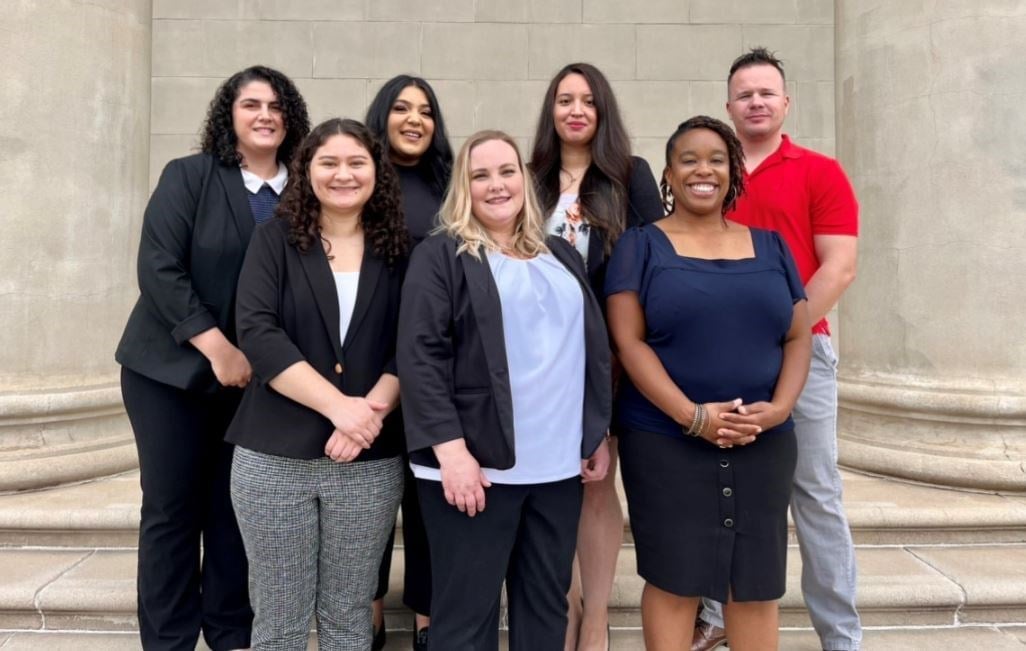 a group of people posing for a photo