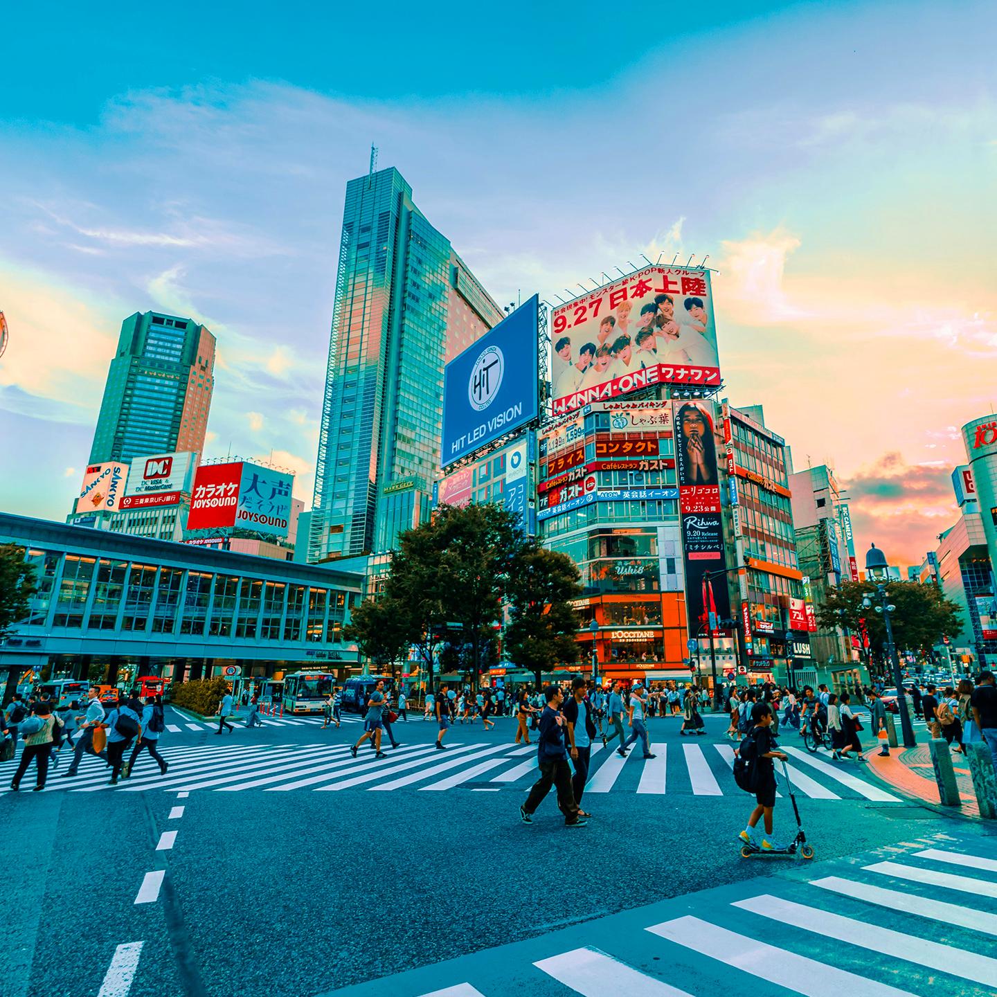 a city street with people walking and buildings
