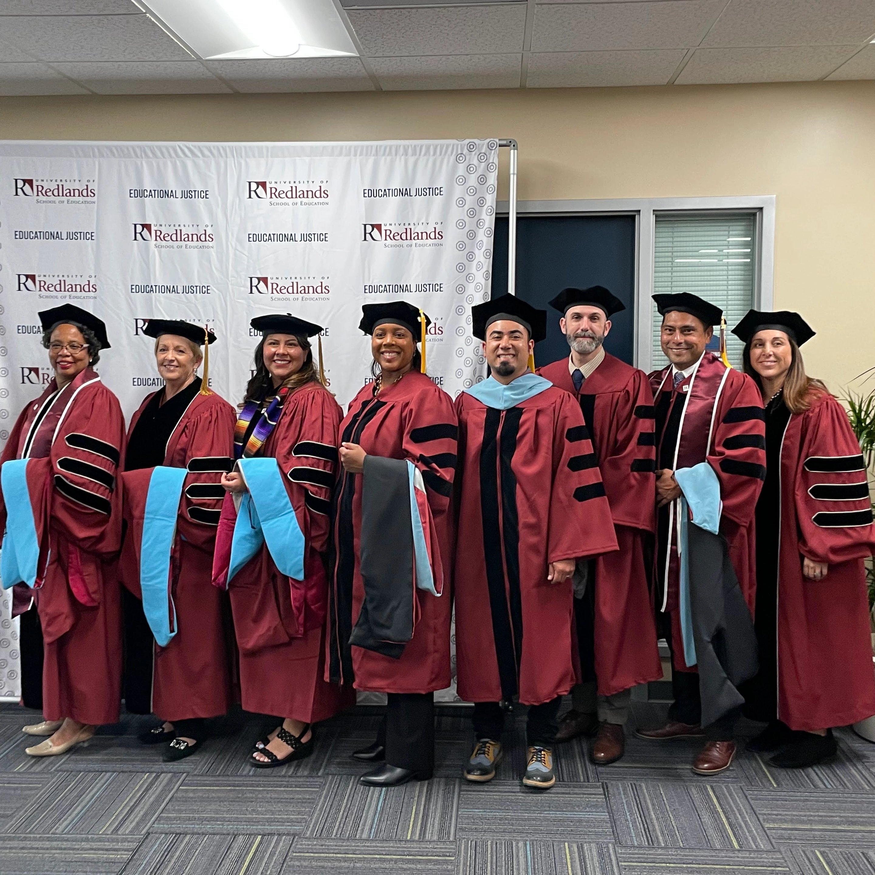 a group of people wearing graduation gowns