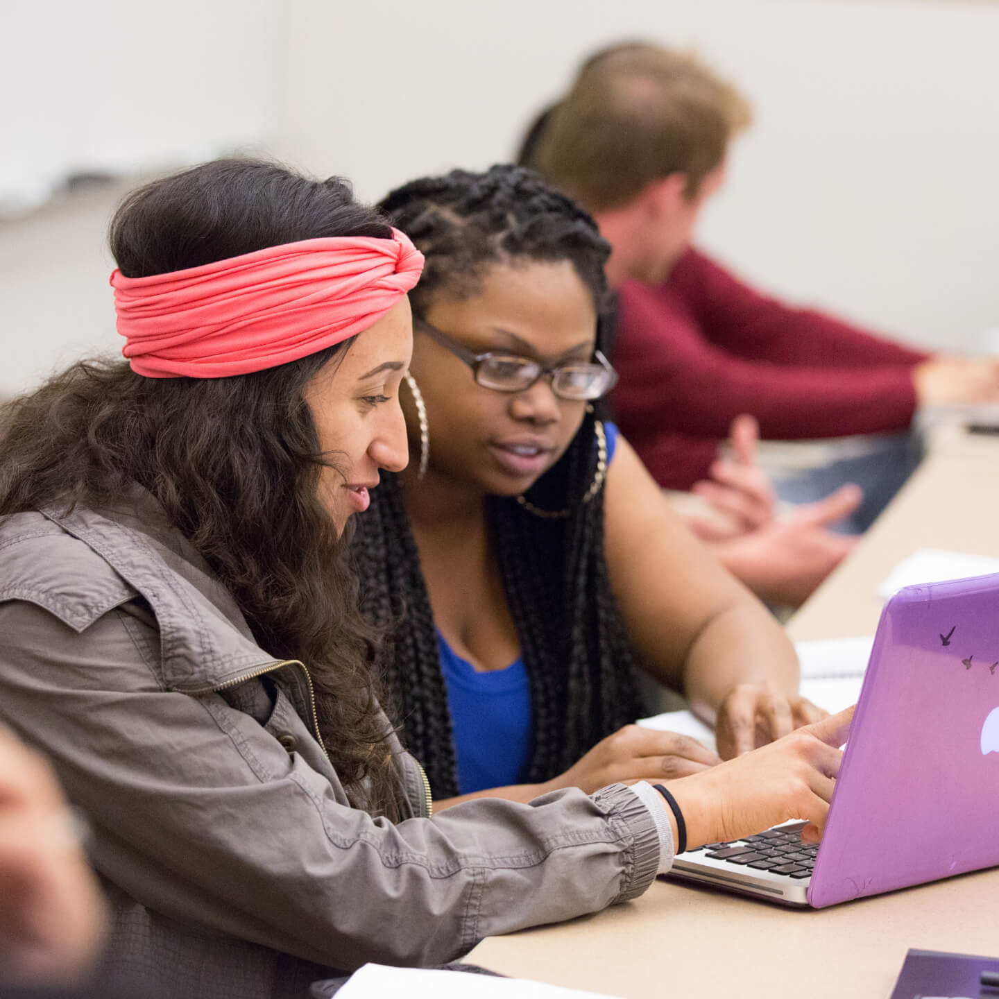 a woman looking at a laptop