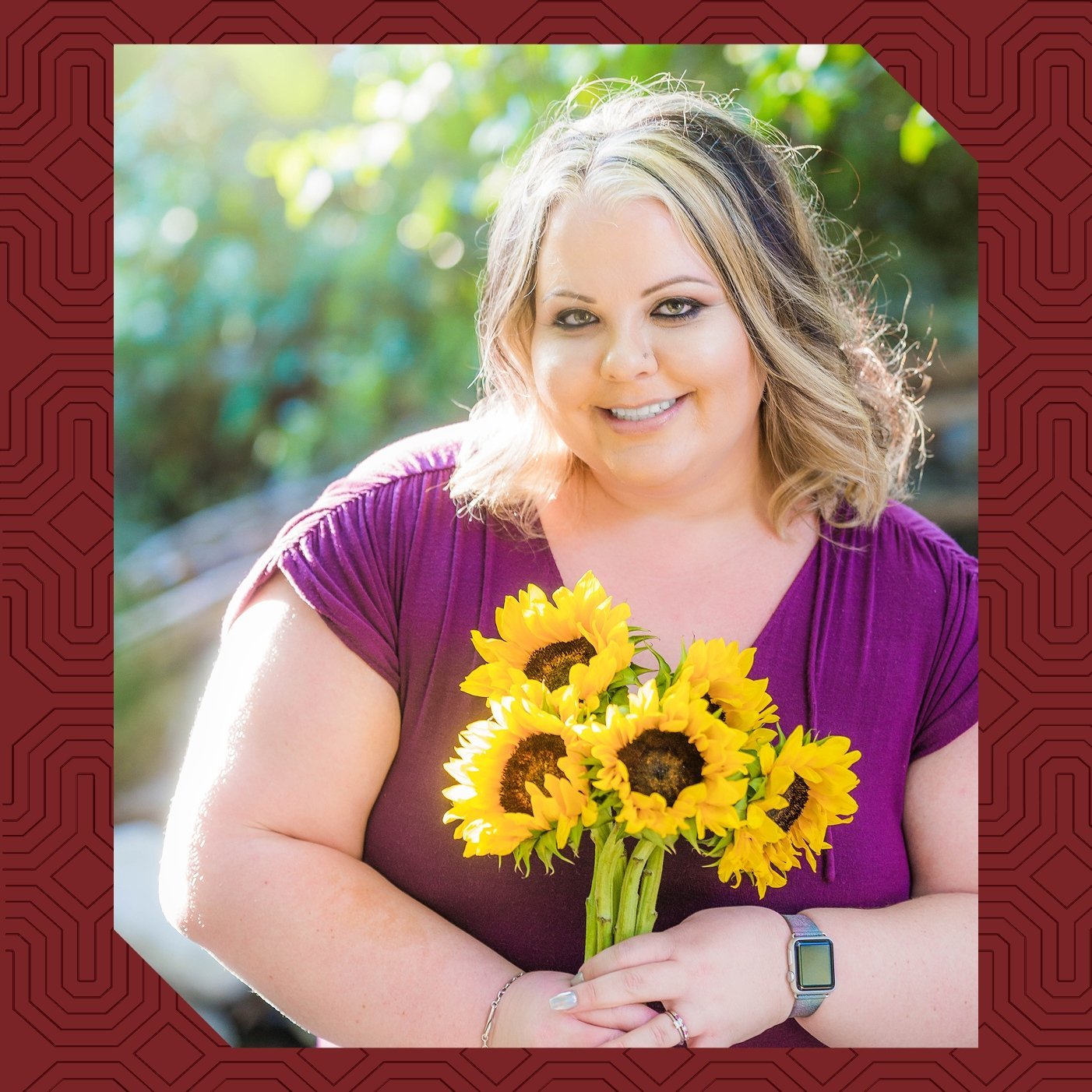 a woman holding a bouquet of sunflowers