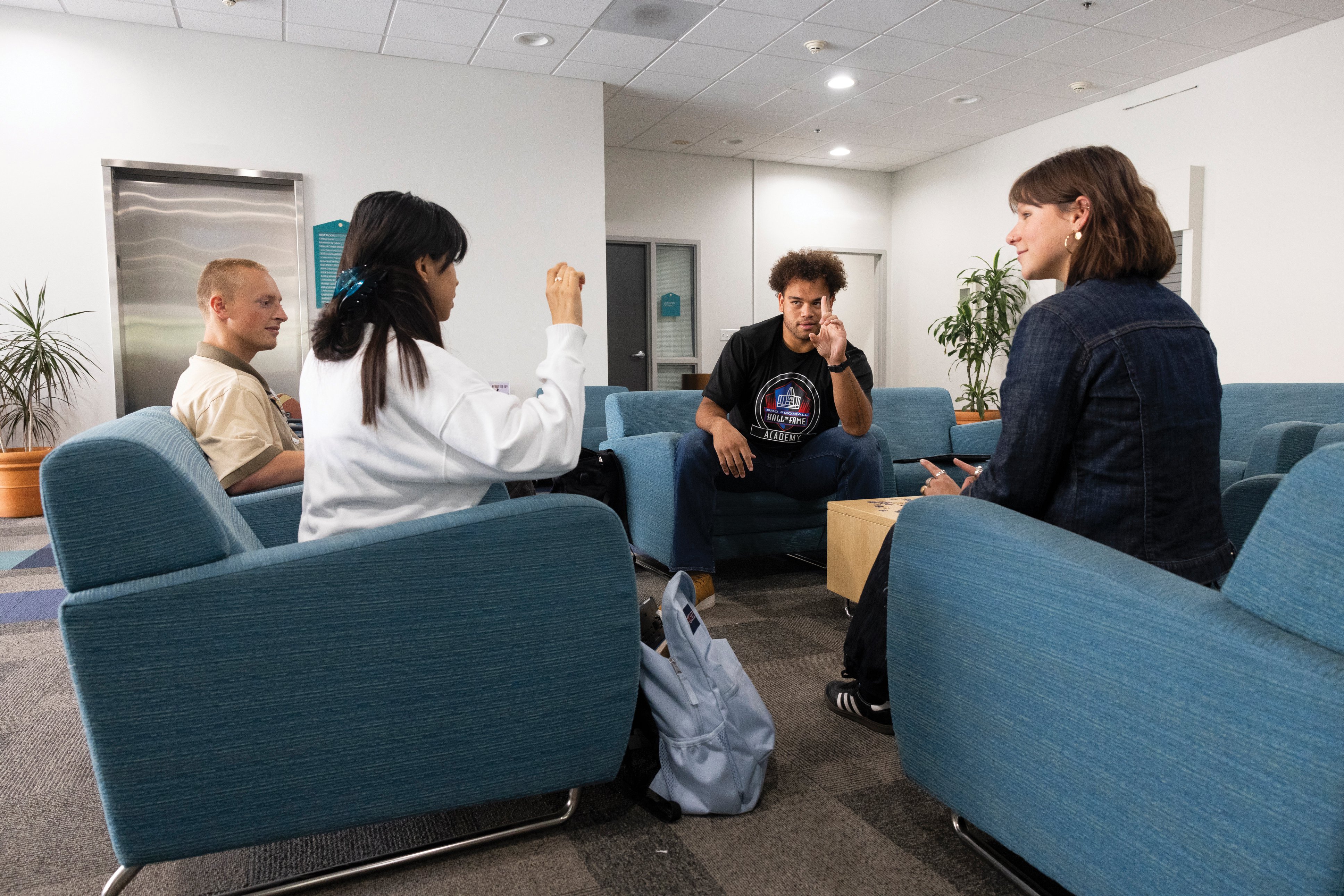 a group of people sitting in chairs