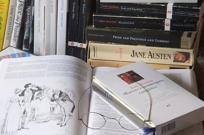 a book with glasses on top of it