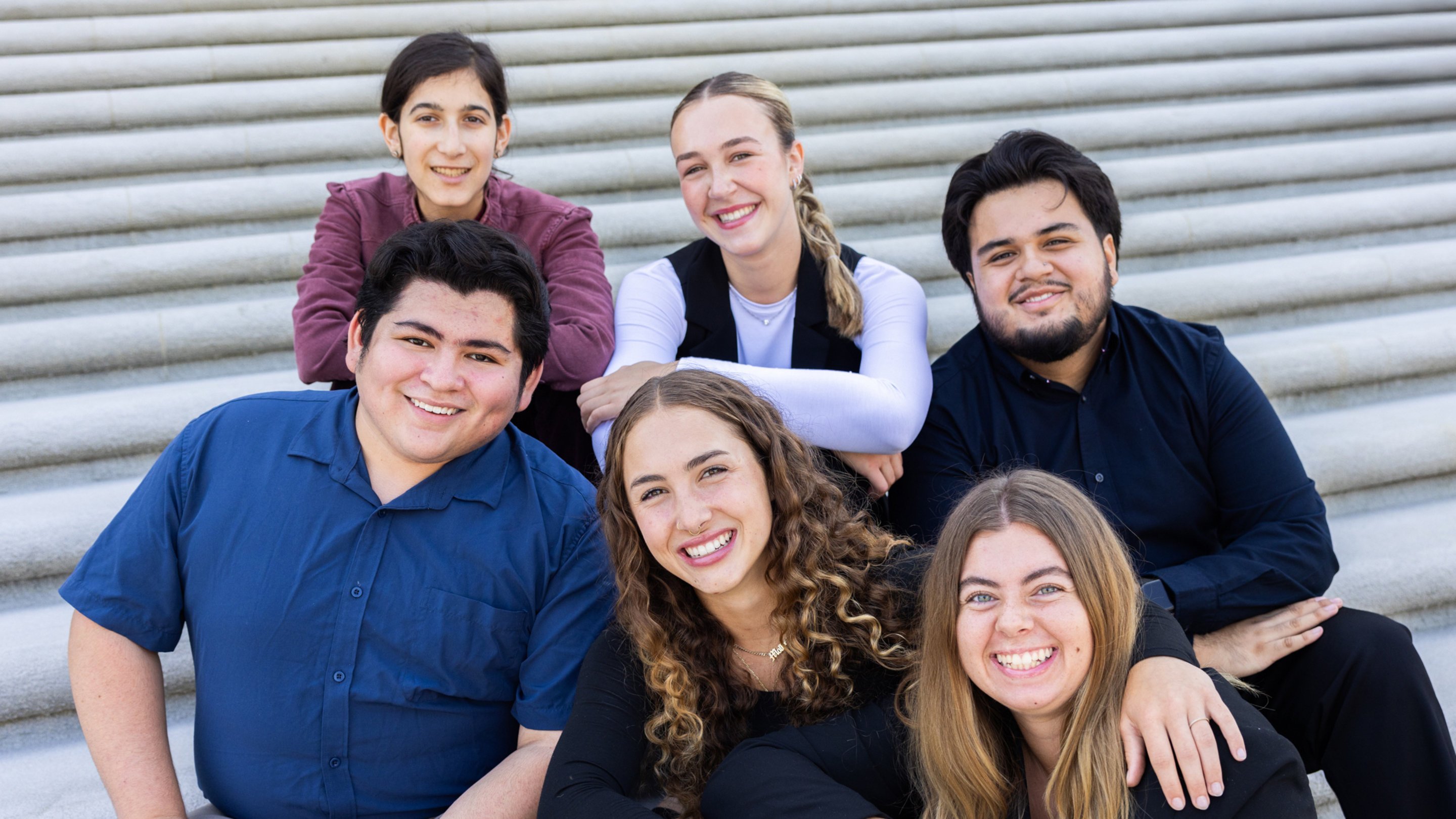 a group of people posing for a photo