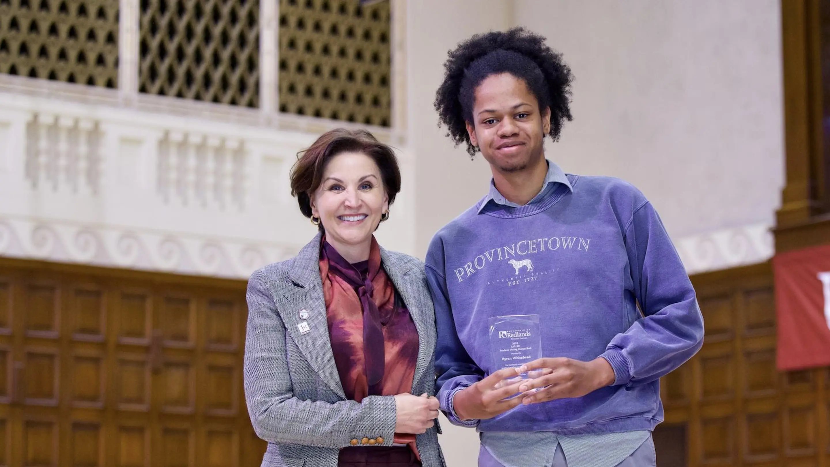a person and person holding a trophy