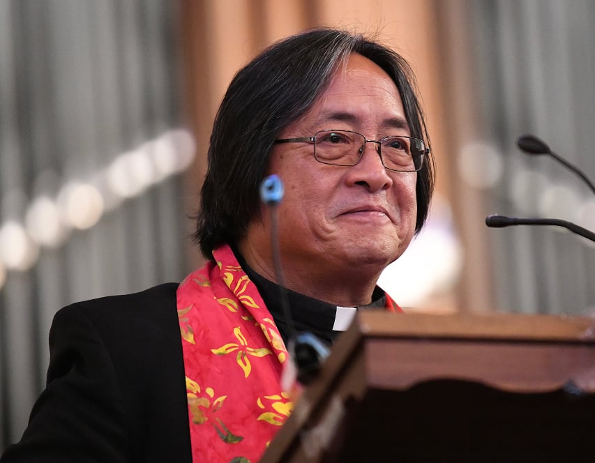 a man in glasses and a red scarf