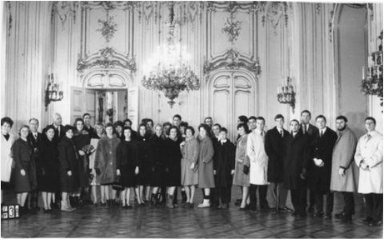 a group of people standing in a room