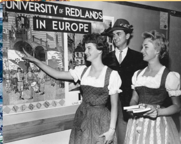 a group of people standing in front of a poster