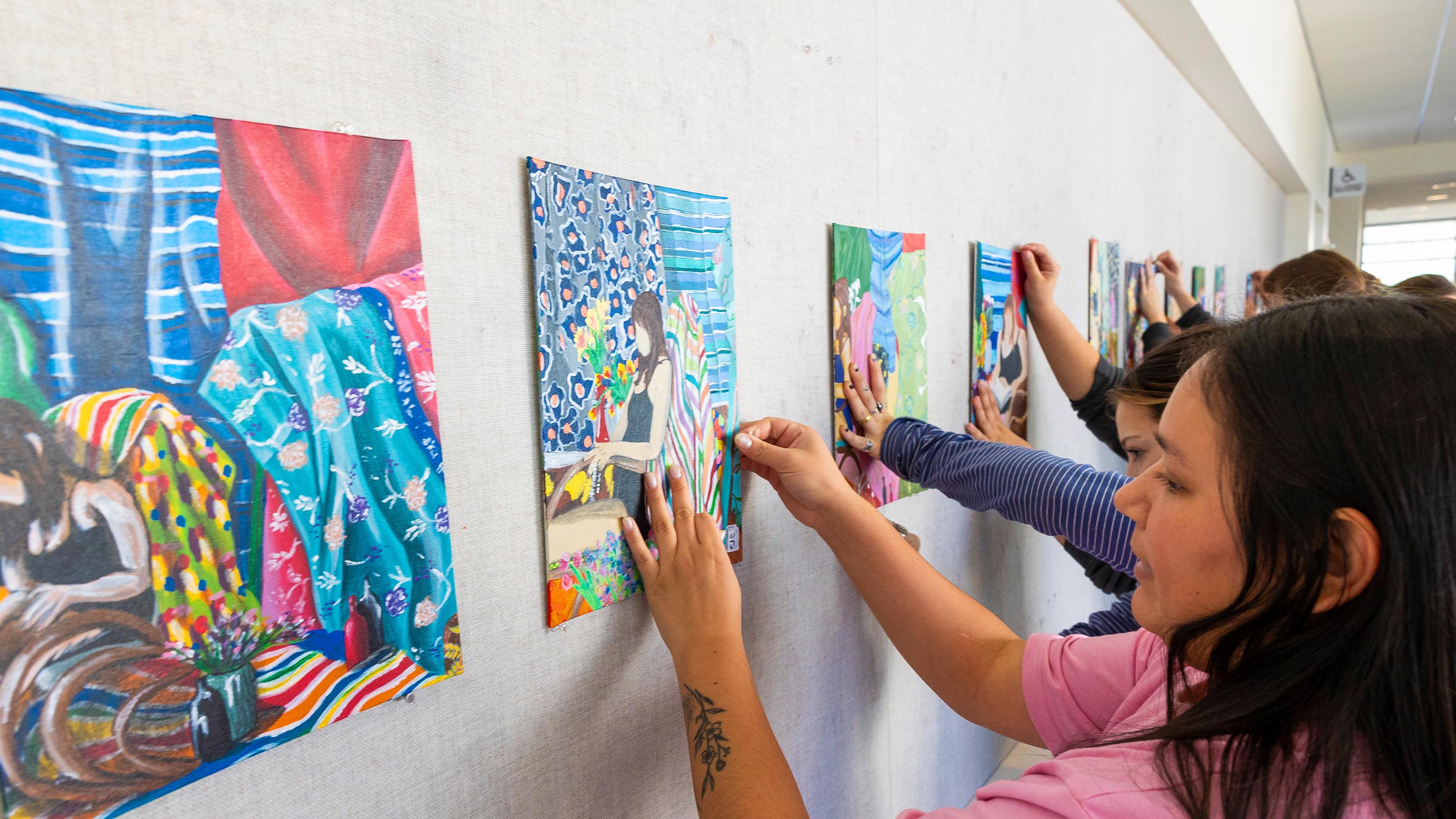 a group of people pictures on a wall
