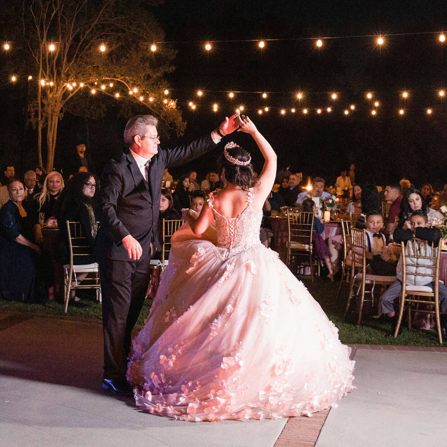 a man and woman dancing at night