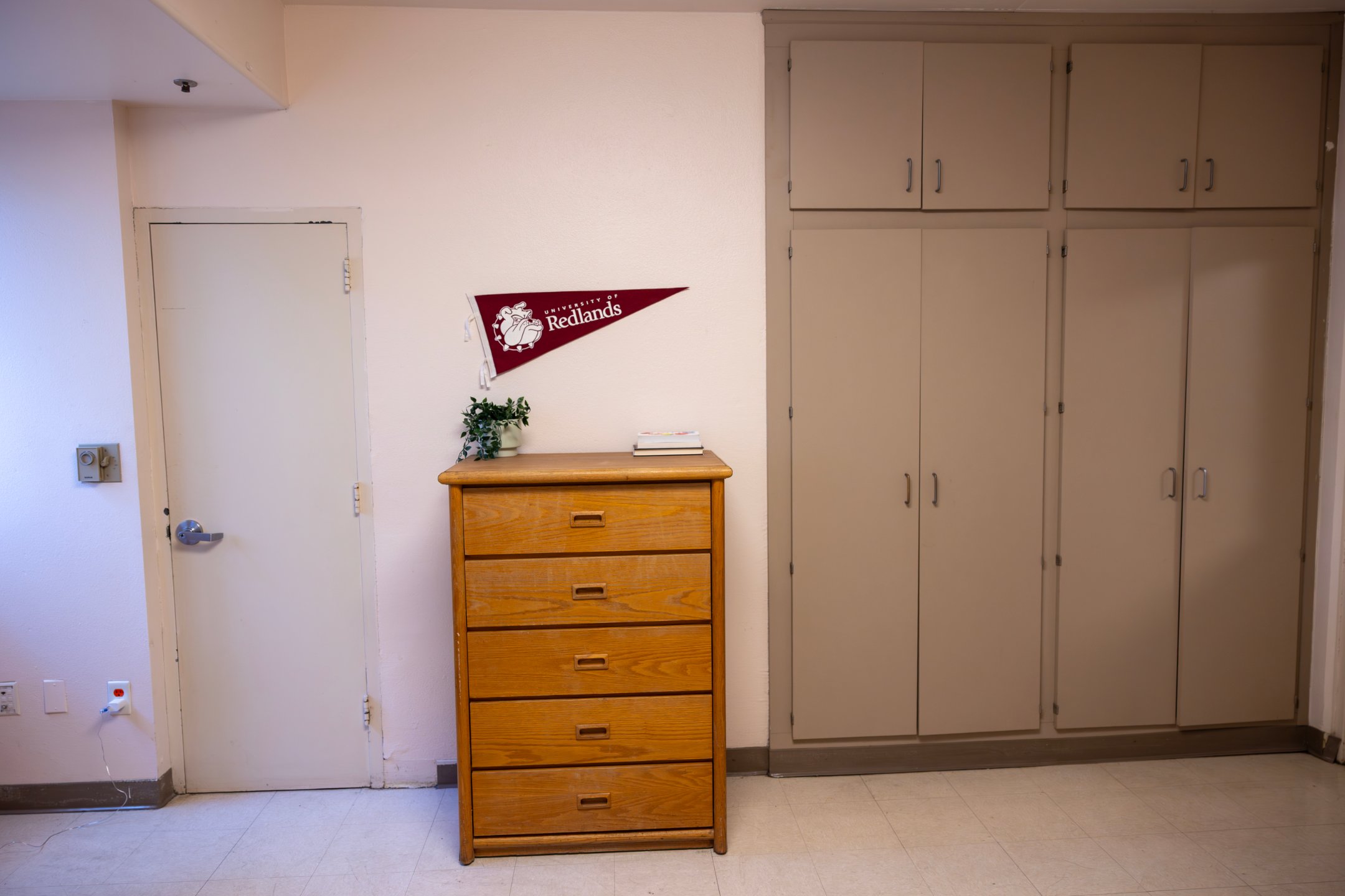 a wooden dresser in a room