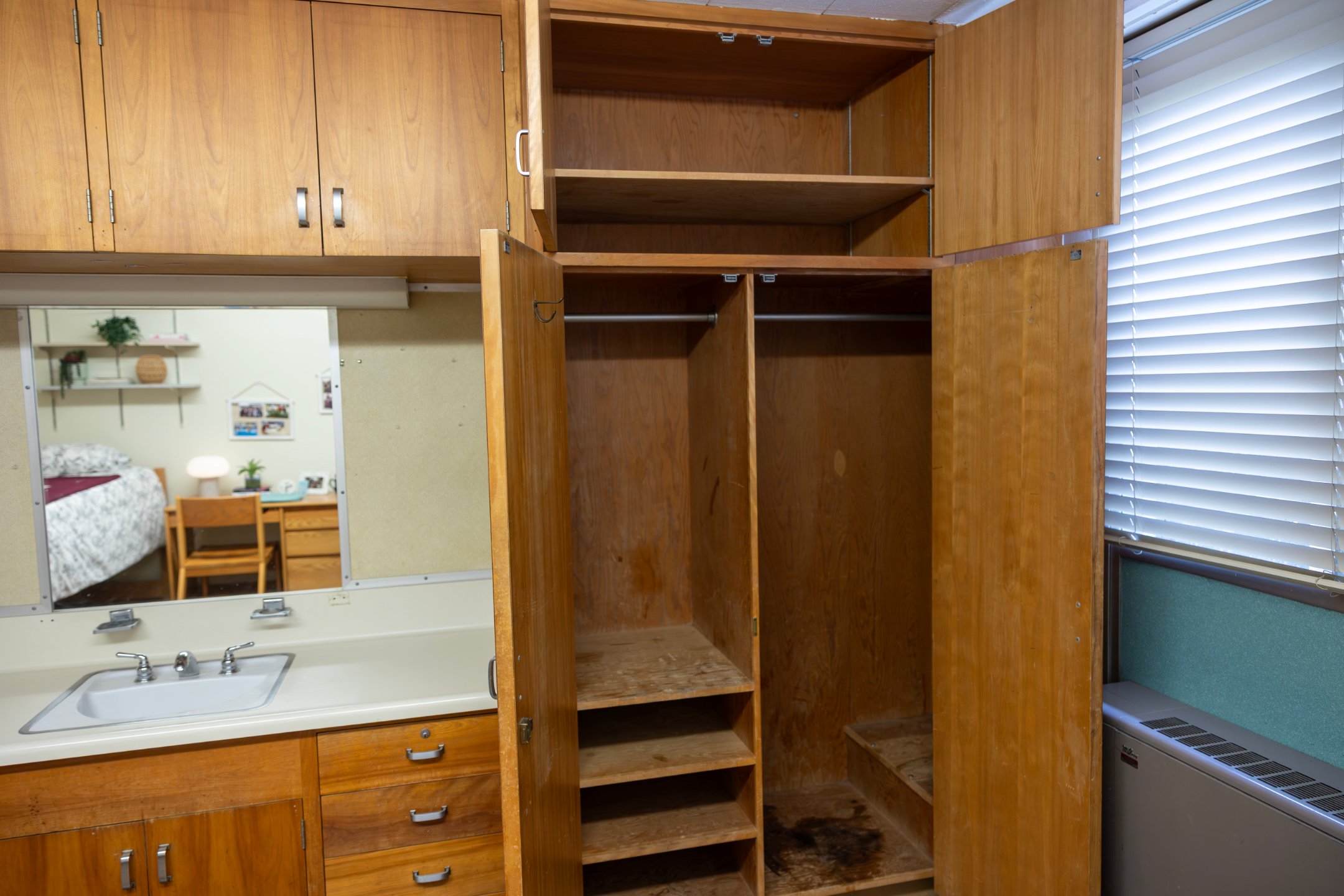 a wooden cabinets with shelves