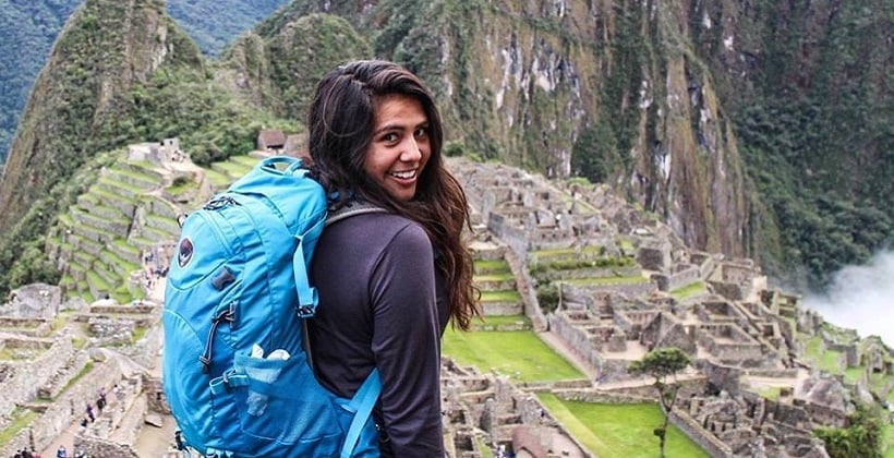 a person with a backpack on a mountain