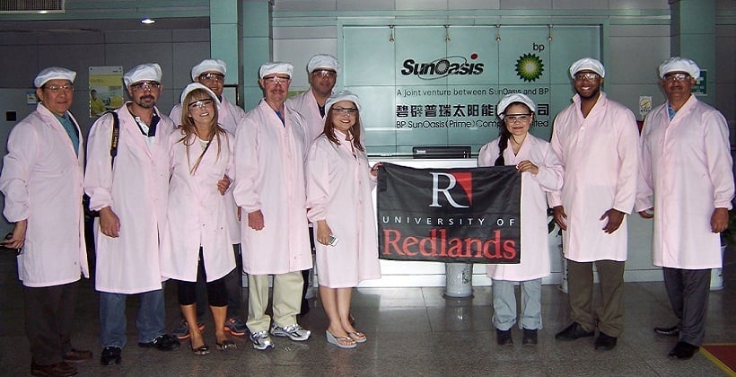 a group of people wearing white coats and hats